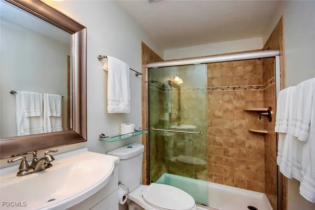 a view of a house with pool and chairs