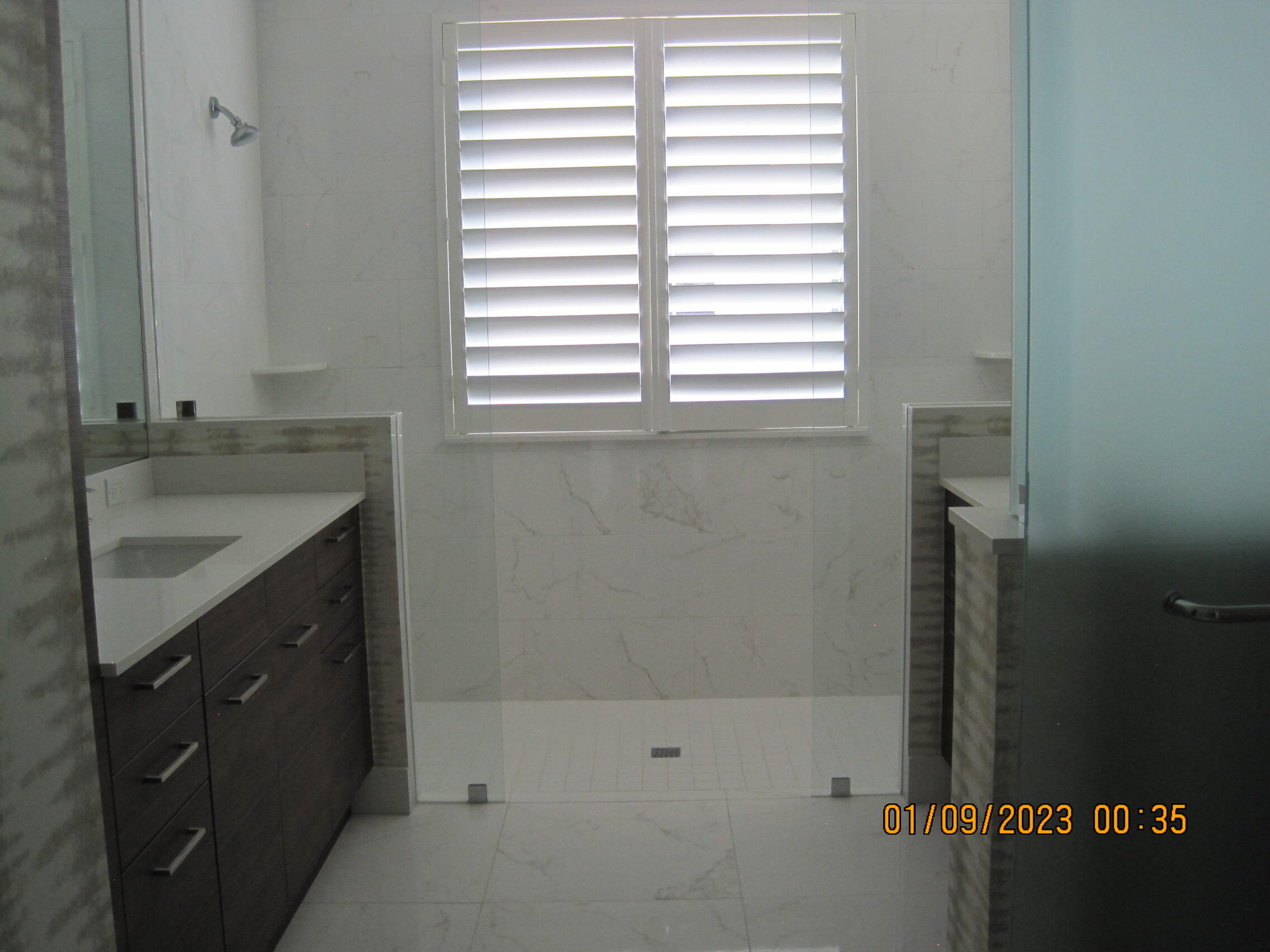 4033 Northwest 17th Way Boca Raton, FL 33431 - Photo 17 of 17 a bathroom with a sink a vanity and a window