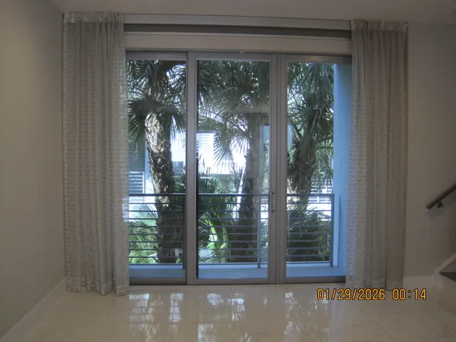 a view of a room that has a large window