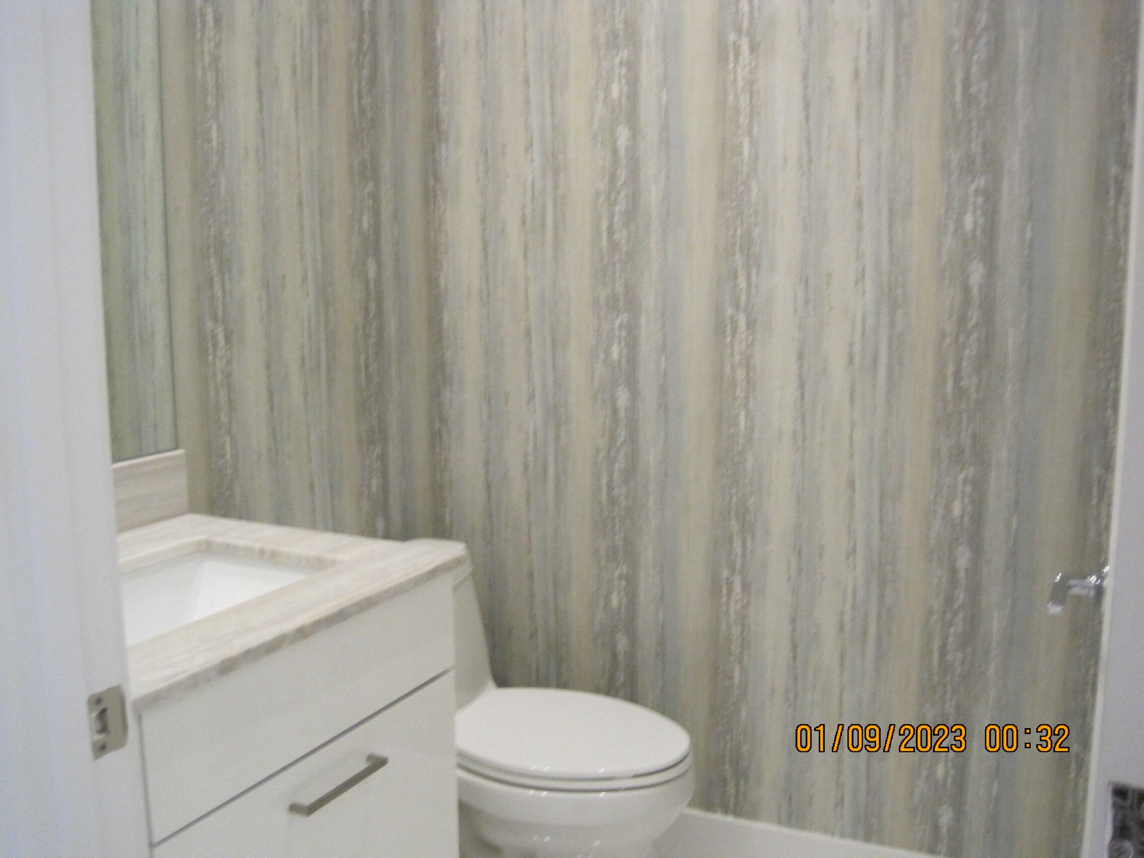 4033 Northwest 17th Way Boca Raton, FL 33431 - Photo 9 of 17 a bathroom with a toilet a sink and curtain