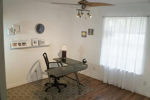 a room with pool table and mirror