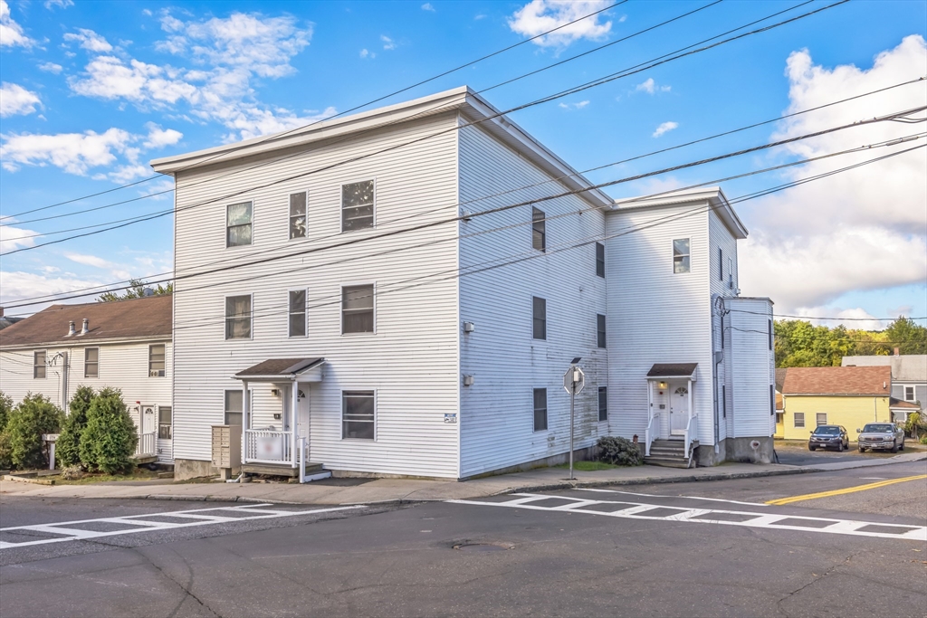 a view of a house with a street