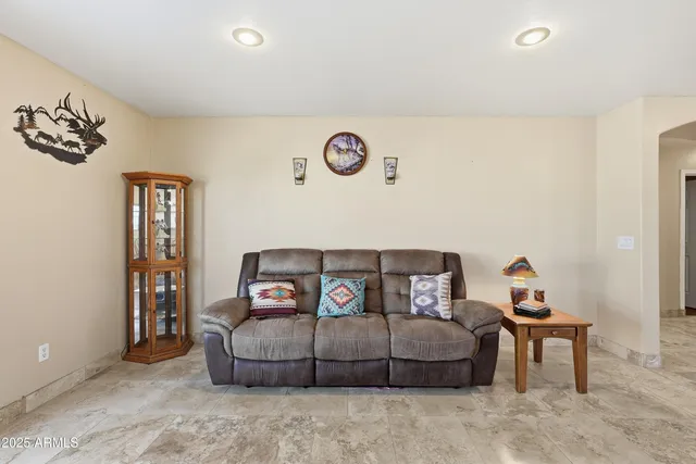 a bedroom with a bed and a table