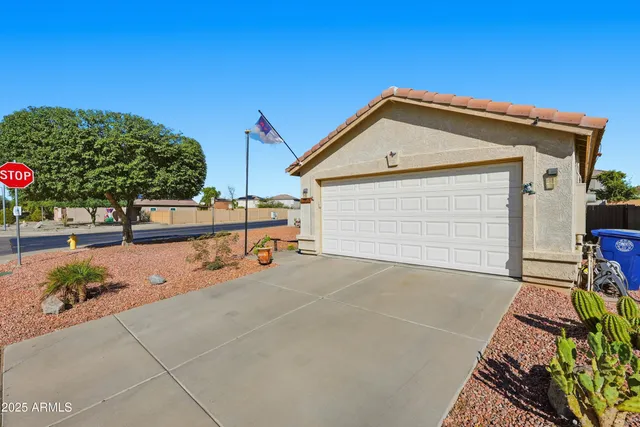 a bathroom with a sink a toilet and shower curtain