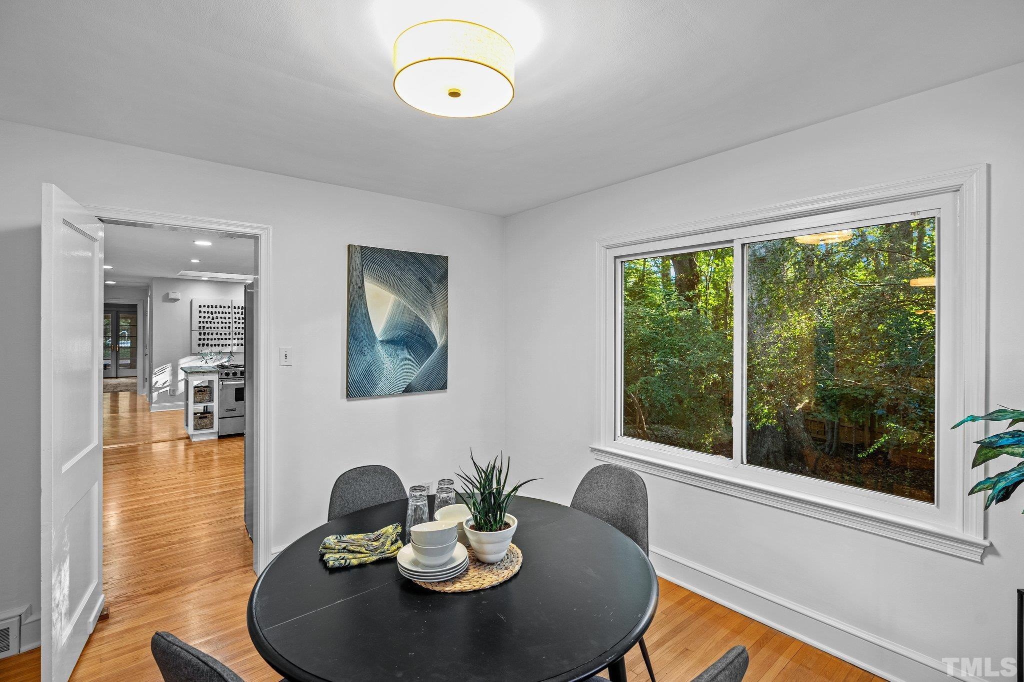386 St Marys Road Hillsborough, NC 27278 - Photo 16 of 64 a view of a dining room with a table and chairs