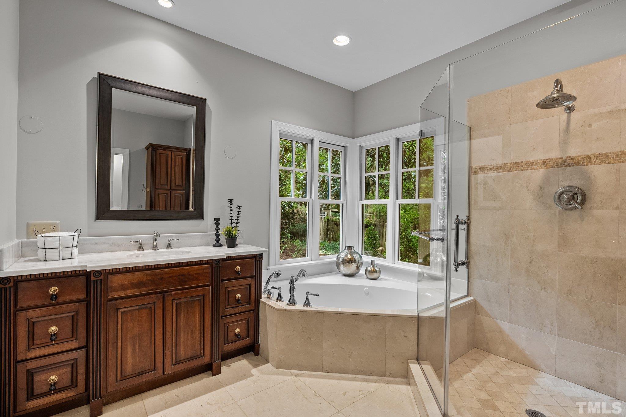 386 St Marys Road Hillsborough, NC 27278 - Photo 33 of 64 a bathroom with a tub sink and mirror