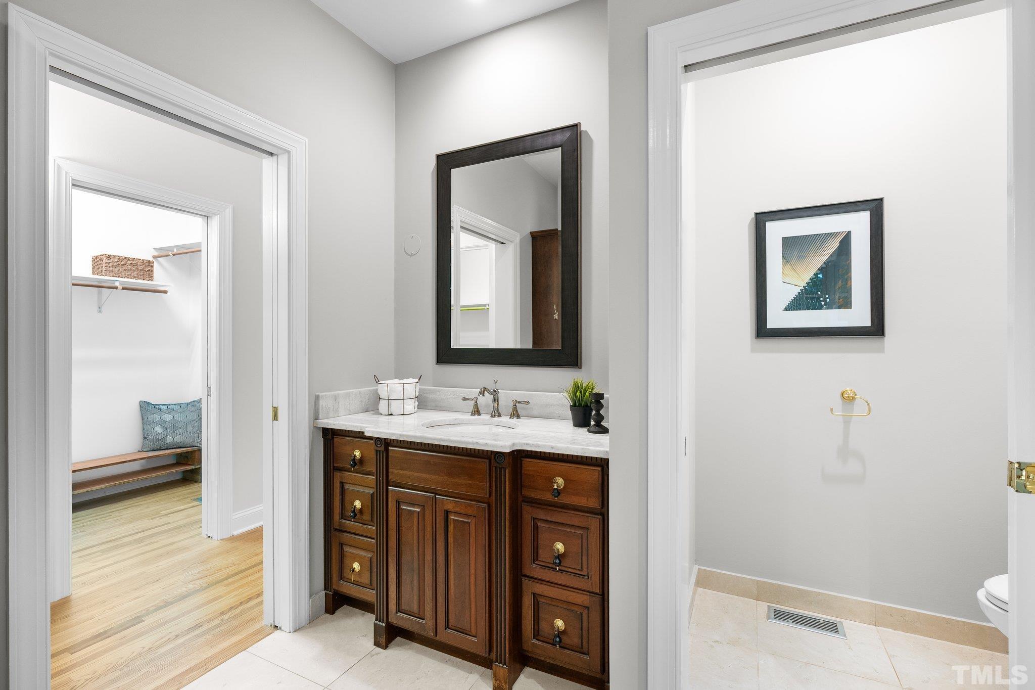 386 St Marys Road Hillsborough, NC 27278 - Photo 34 of 64 a bathroom with 2 sink and a mirror