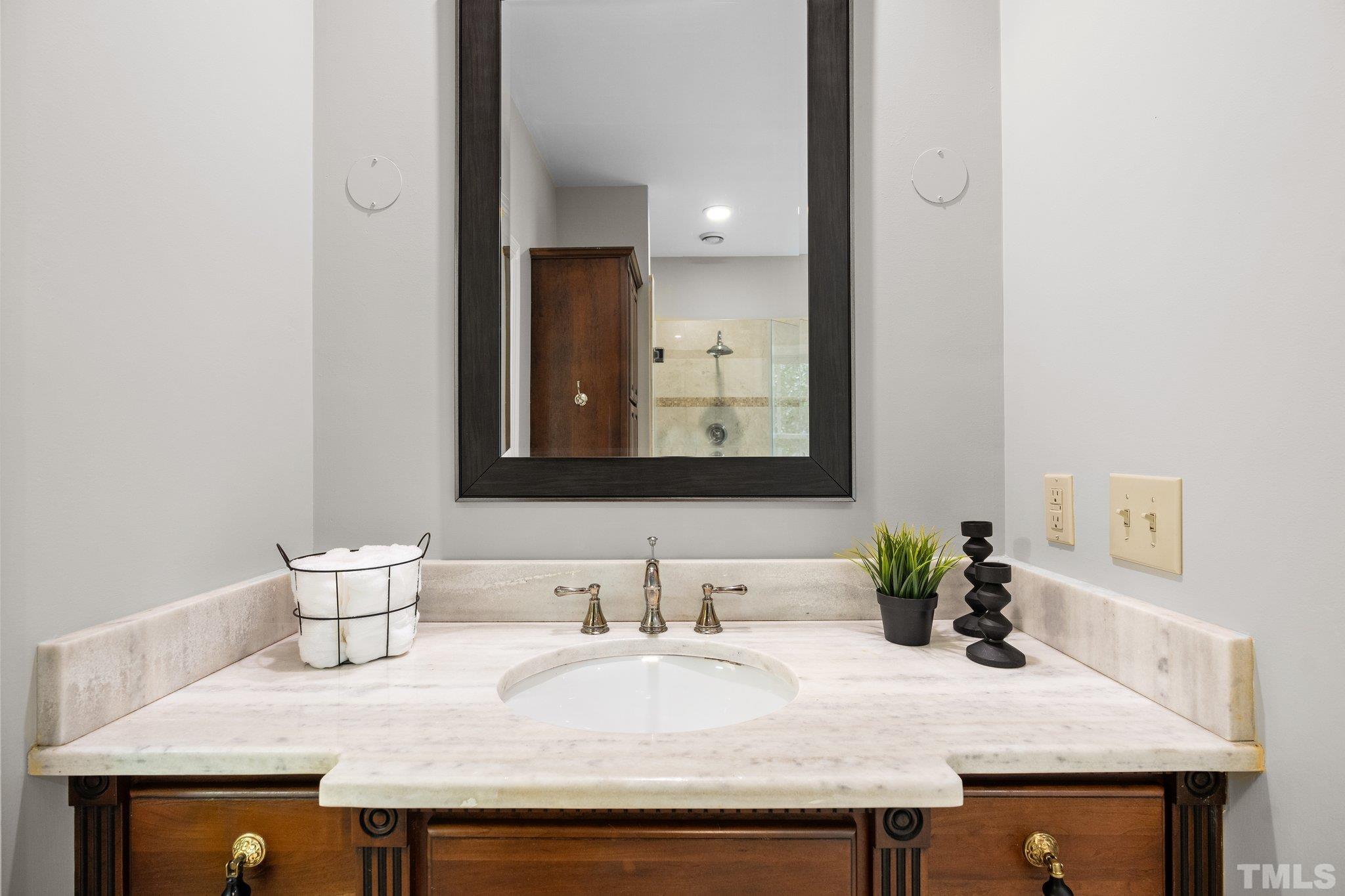 386 St Marys Road Hillsborough, NC 27278 - Photo 35 of 64 a bathroom with a granite countertop sink and a mirror