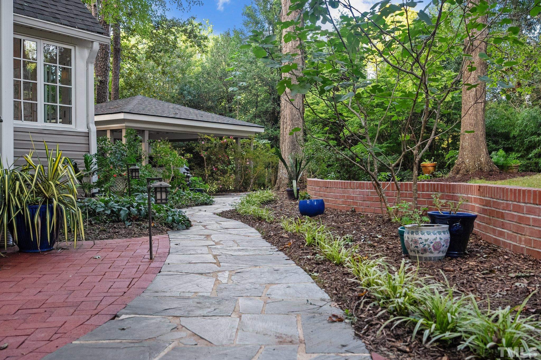 386 St Marys Road Hillsborough, NC 27278 - Photo 48 of 64 a view of a backyard with sitting area