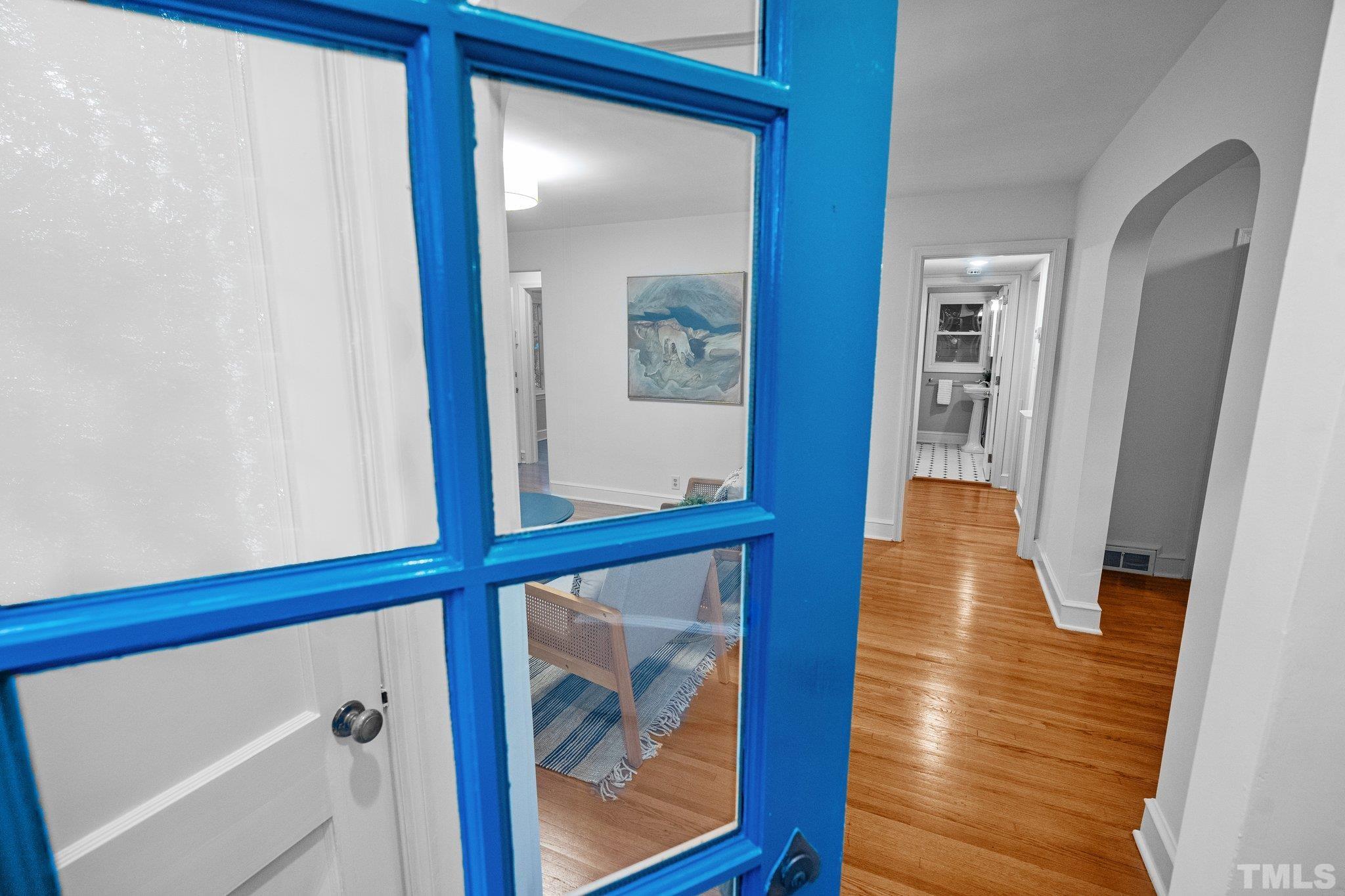 386 St Marys Road Hillsborough, NC 27278 - Photo 5 of 64 a view of a hallway with wooden floor and staircase