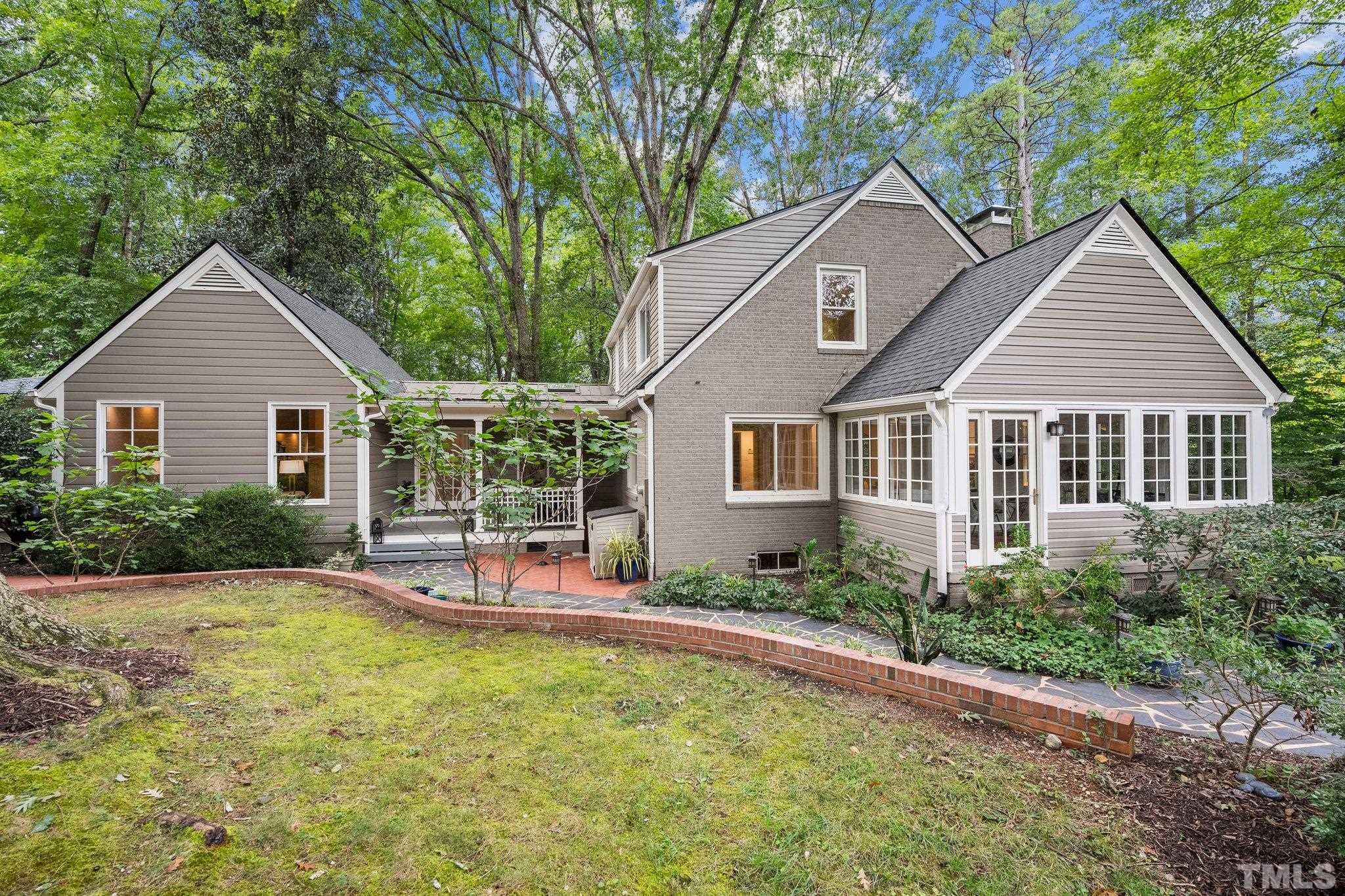 386 St Marys Road Hillsborough, NC 27278 - Photo 55 of 64 a view of a house with a yard patio and fire pit