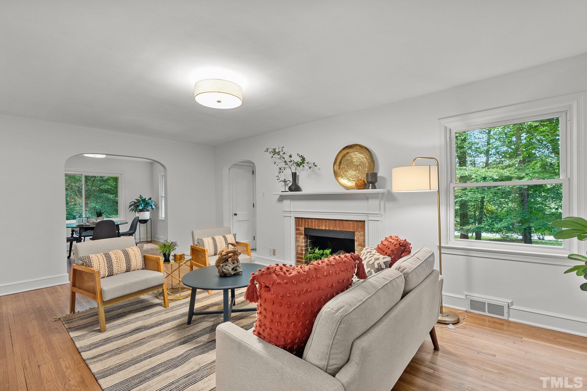 386 St Marys Road Hillsborough, NC 27278 - Photo 7 of 64 a living room with furniture and a fireplace