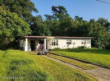 7143 Oakney Road Jacksonville, FL 32211 - Photo 3 of 5 a view of a backyard with table and chairs and a large tree