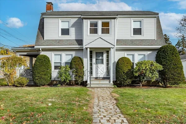 a front view of a house with garden