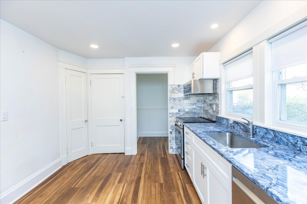 2 Martin Street Marblehead, MA 01945 - Photo 14 of 40 a kitchen with granite countertop a sink and cabinets