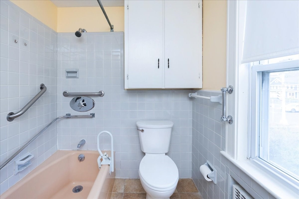 2 Martin Street Marblehead, MA 01945 - Photo 24 of 40 a bathroom with a toilet a sink and bathtub