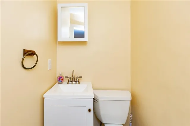 a bathroom with a toilet and a sink