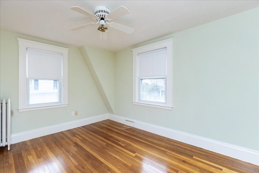 2 Martin Street Marblehead, MA 01945 - Photo 30 of 40 a view of empty room with wooden floor and fan