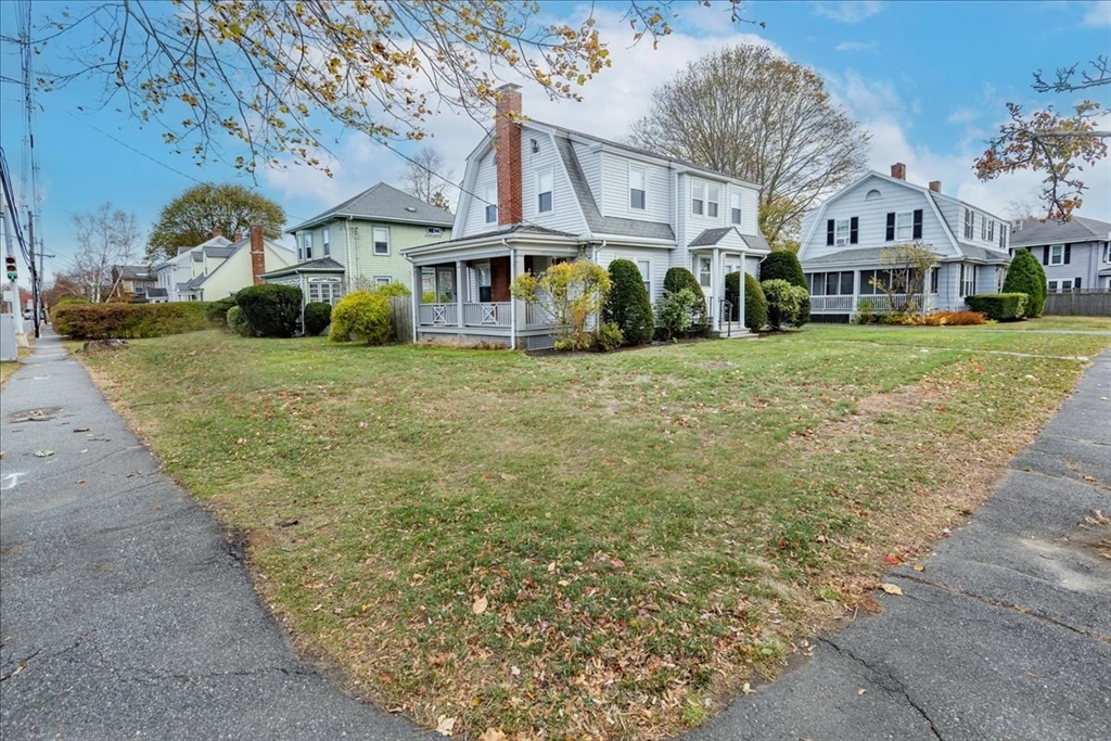 2 Martin Street Marblehead, MA 01945 - Photo 3 of 40 a view of a big house with a big yard and large tree