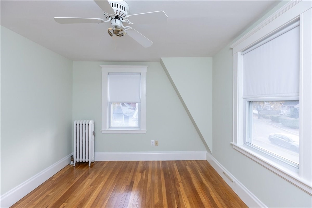 2 Martin Street Marblehead, MA 01945 - Photo 31 of 40 a view of an empty room with wooden floor and a window