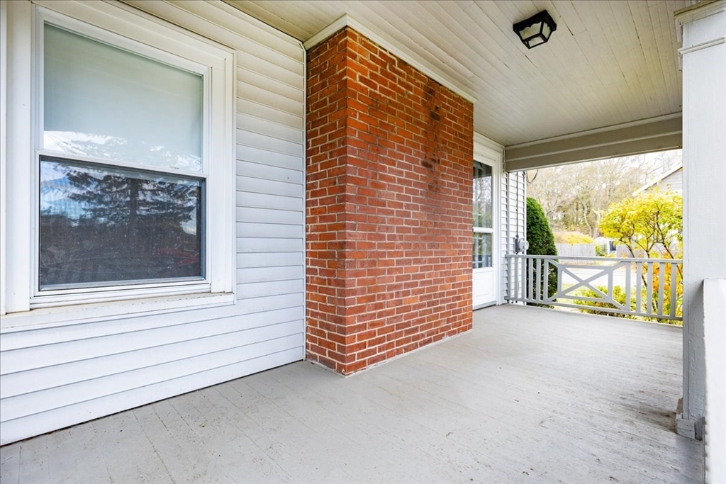 2 Martin Street Marblehead, MA 01945 - Photo 5 of 40 a view of a door and wooden roof