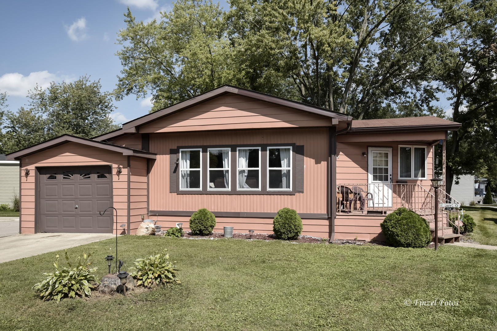 1158 Country Club Road Elgin, IL 60123 - Photo 1 of 16 a front view of a house with a garden