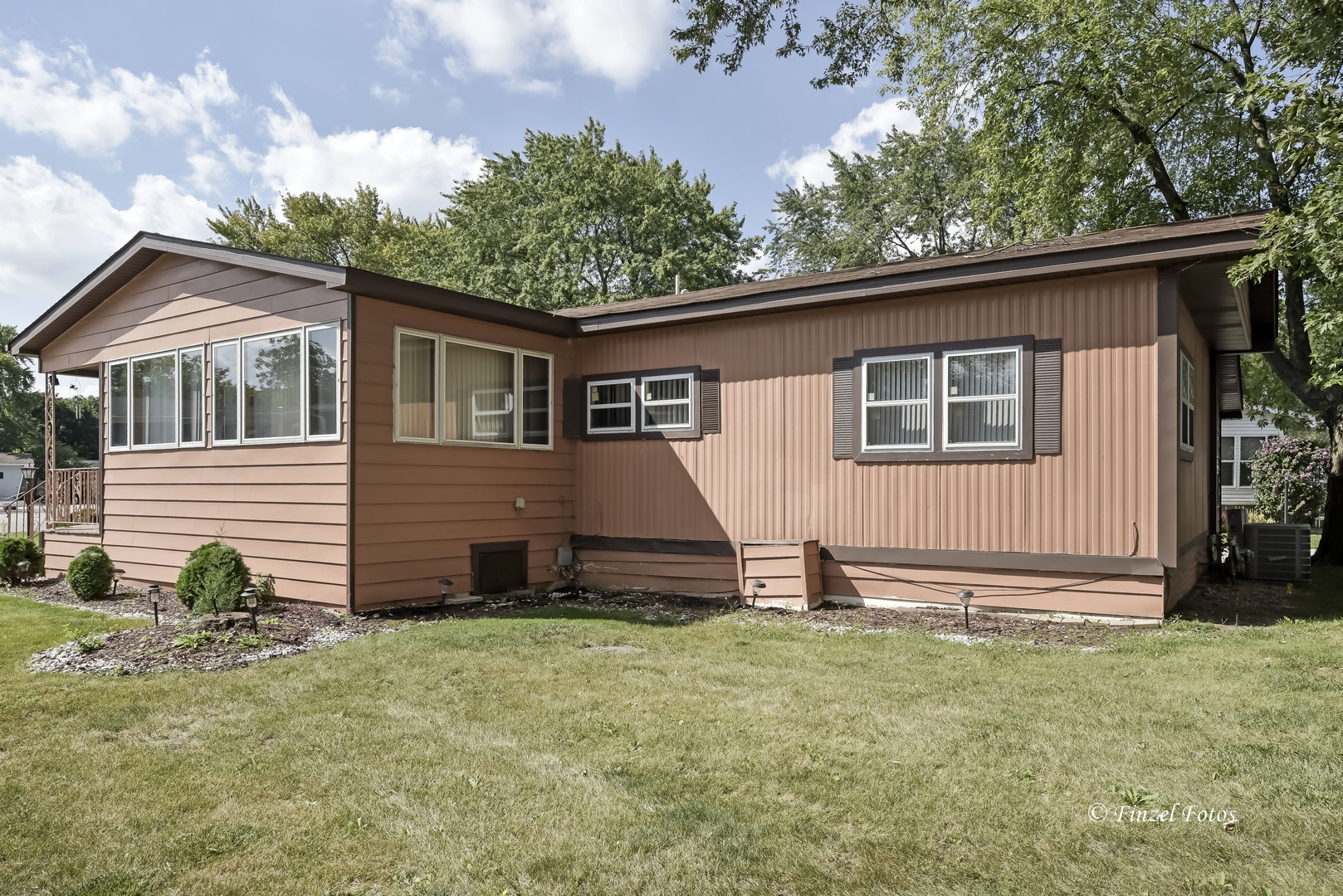 1158 Country Club Road Elgin, IL 60123 - Photo 2 of 16 a view of a house with a yard and wooden fence