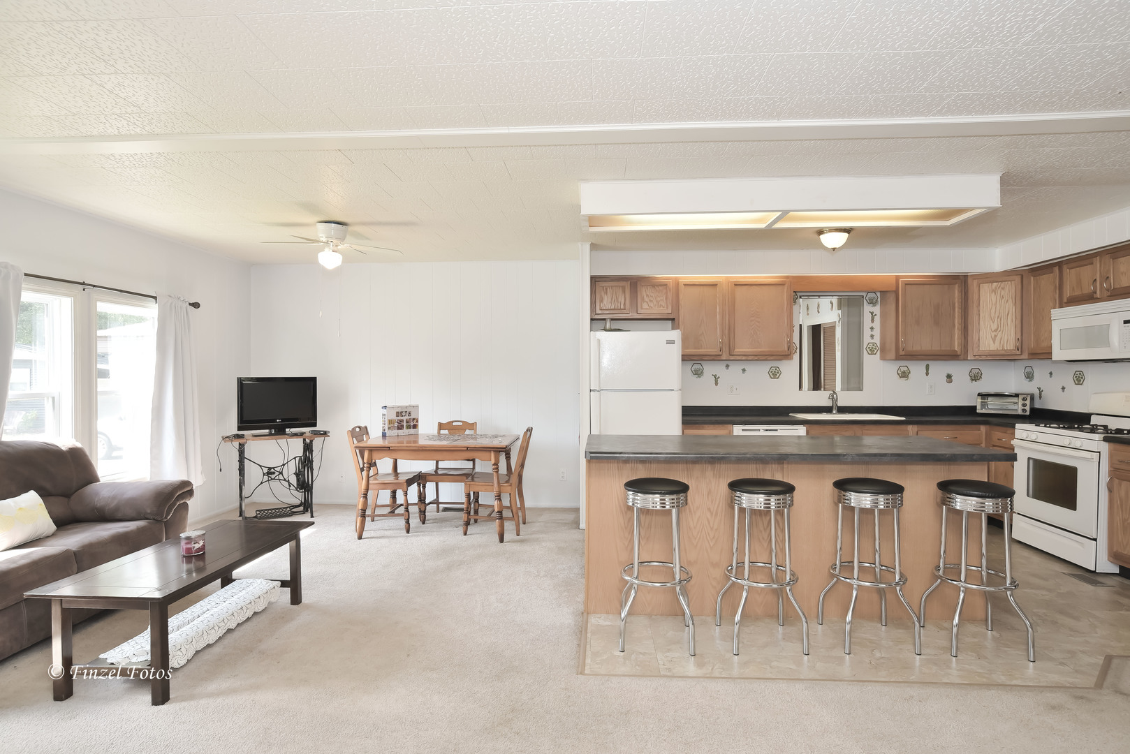 1158 Country Club Road Elgin, IL 60123 - Photo 6 of 16 a view of living room with granite countertop furniture and fireplace