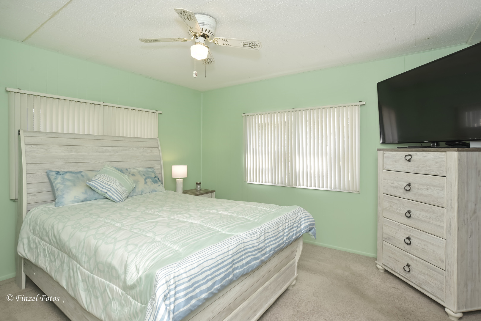 1158 Country Club Road Elgin, IL 60123 - Photo 8 of 16 a bedroom with a bed and a flat screen tv