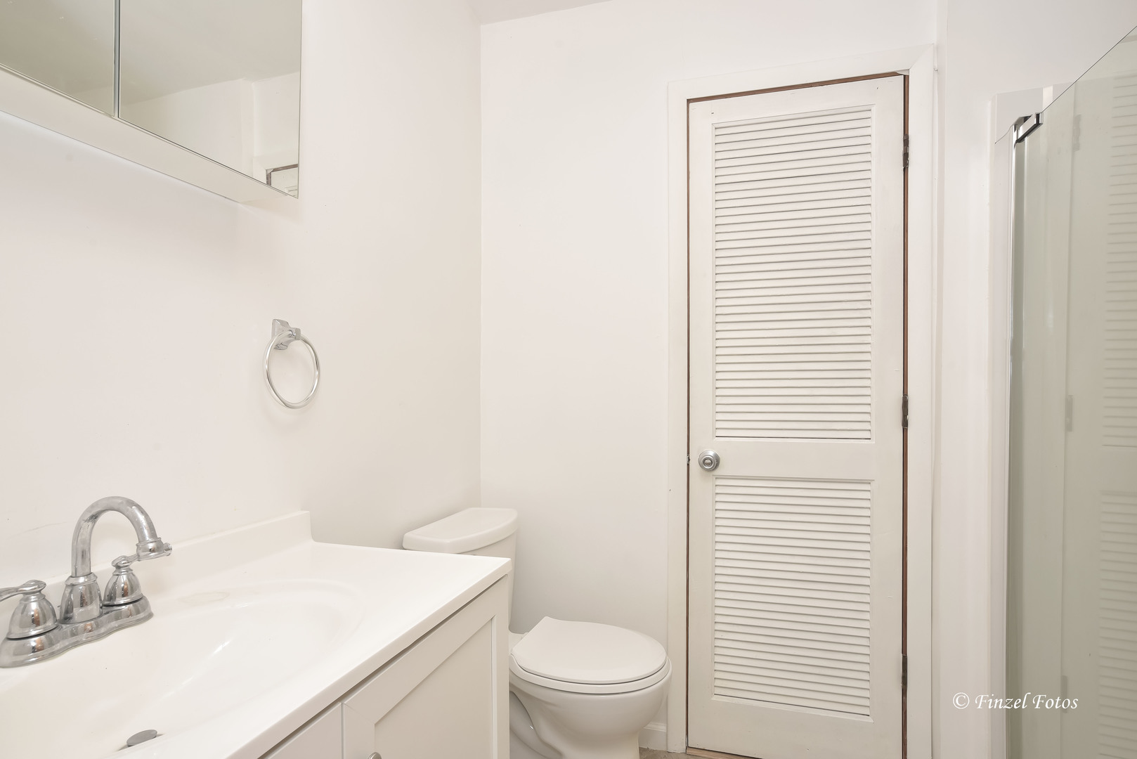 1158 Country Club Road Elgin, IL 60123 - Photo 10 of 16 a bathroom with a toilet sink vanity and mirror