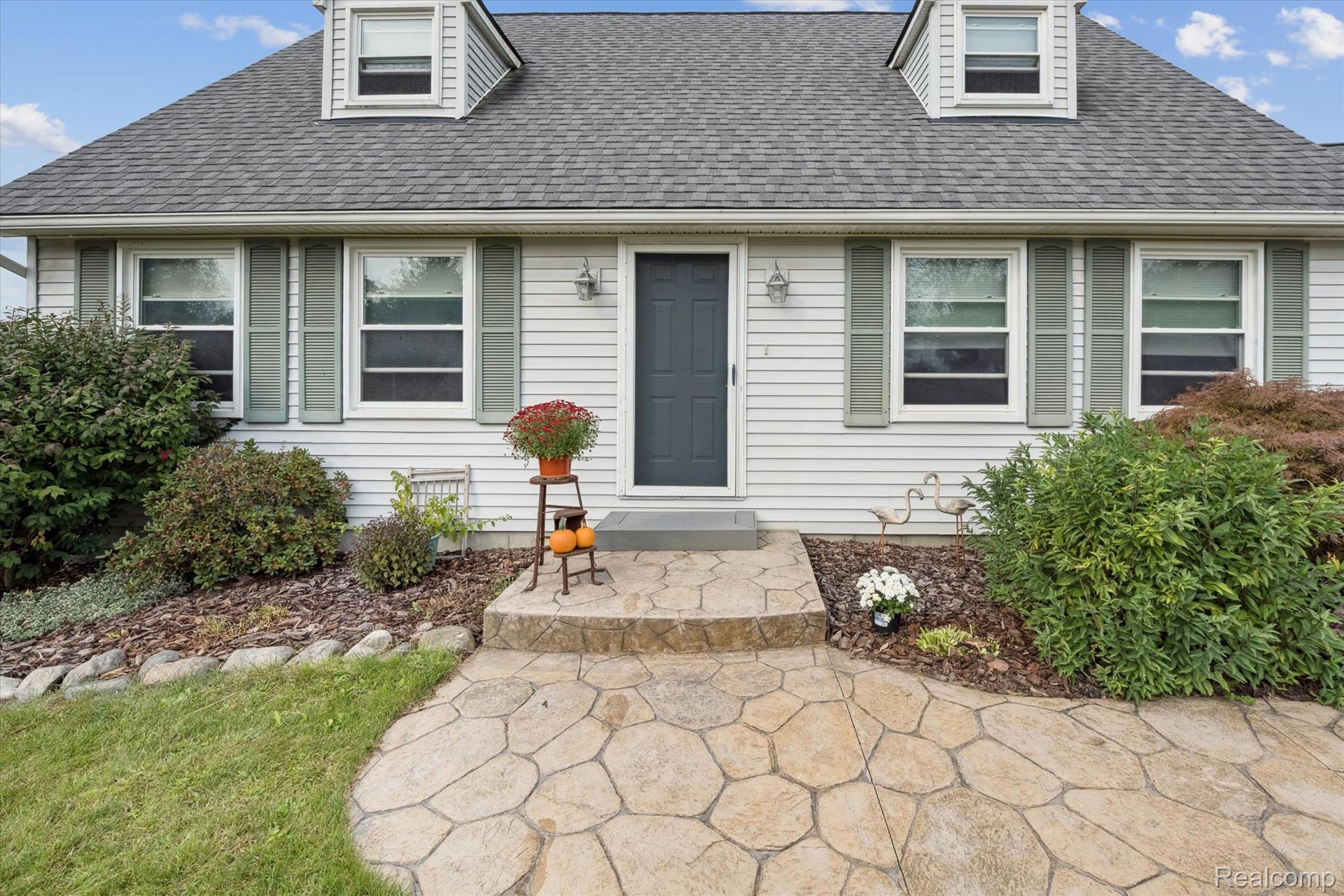 625 Fowlerville Road Fowlerville, MI 48836 - Photo 45 of 55 Welcoming front entry with stamped concrete walkway
