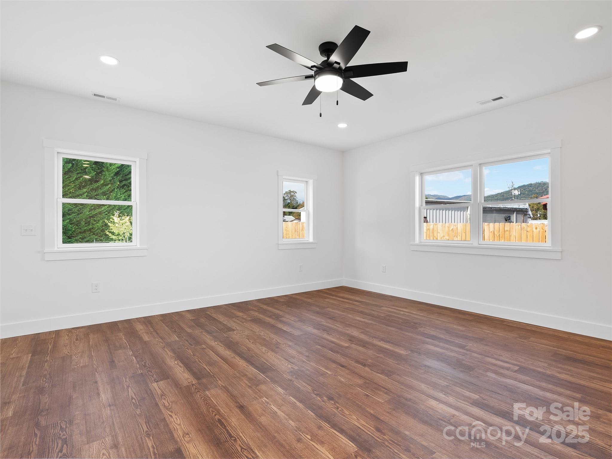 11 Riemar Lane Waynesville, NC 28786 - Photo 11 of 37 a view of an empty room with wooden floor and a window