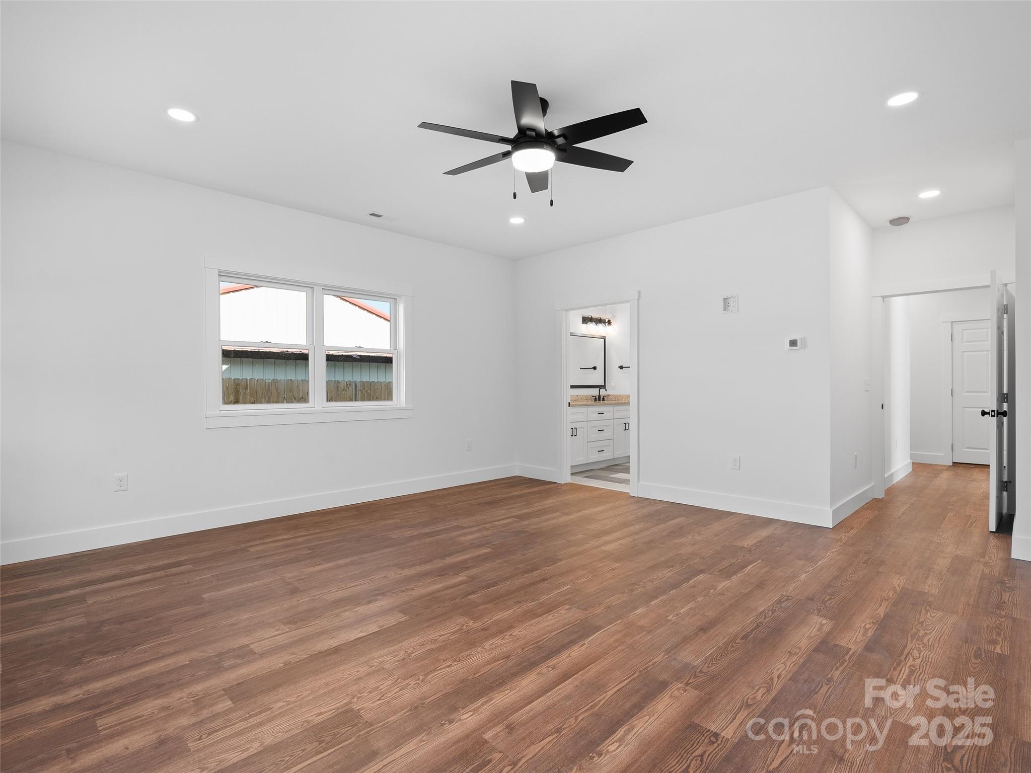 11 Riemar Lane Waynesville, NC 28786 - Photo 12 of 37 a view of an empty room with wooden floor and a window