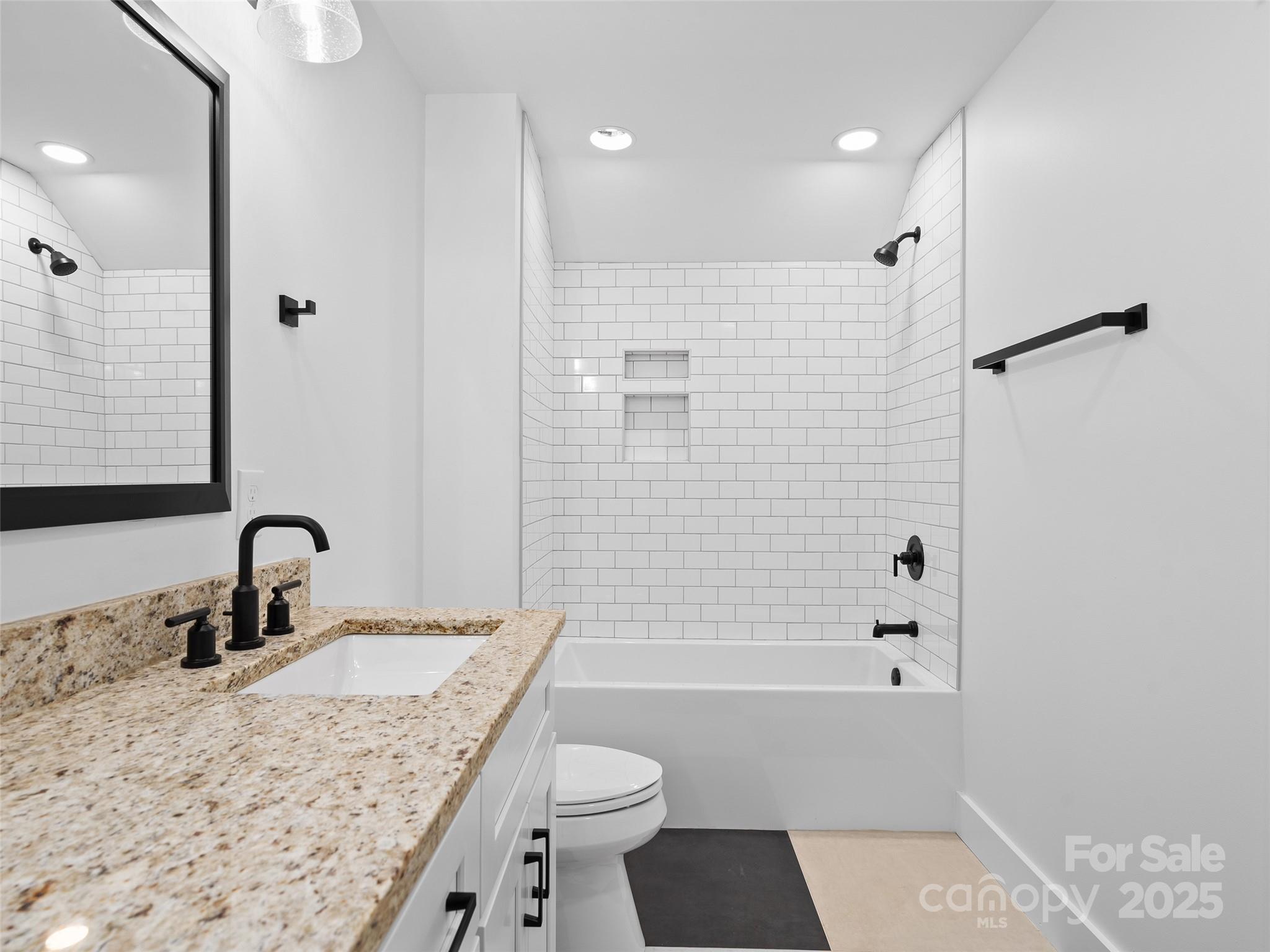 11 Riemar Lane Waynesville, NC 28786 - Photo 16 of 37 a bathroom with a granite countertop sink toilet and shower