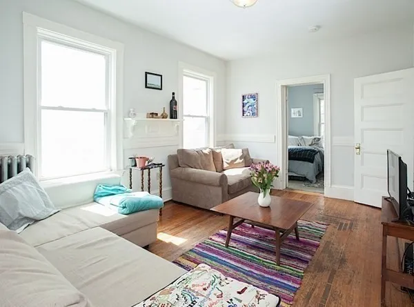 a living room with furniture and a window