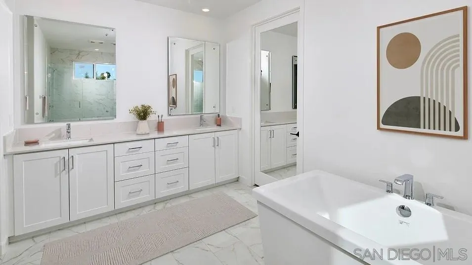 2312 Loker Way Oceanside, CA 92054 - Photo 15 of 20 a bathroom with a tub sink and mirror
