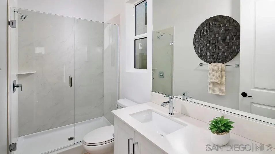 2312 Loker Way Oceanside, CA 92054 - Photo 2 of 20 a bathroom with a sink toilet and shower