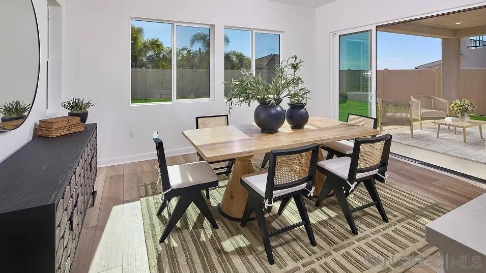 2312 Loker Way Oceanside, CA 92054 - Photo 7 of 20 a view of a dining room with furniture window and wooden floor