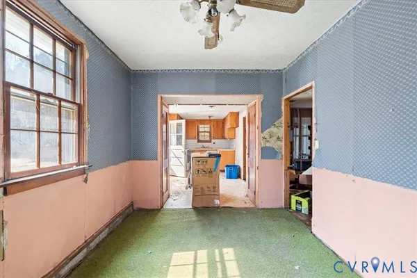 a kitchen with a sink a stove and cabinets