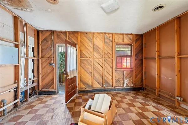 a view of a house with swimming pool and yard with trees