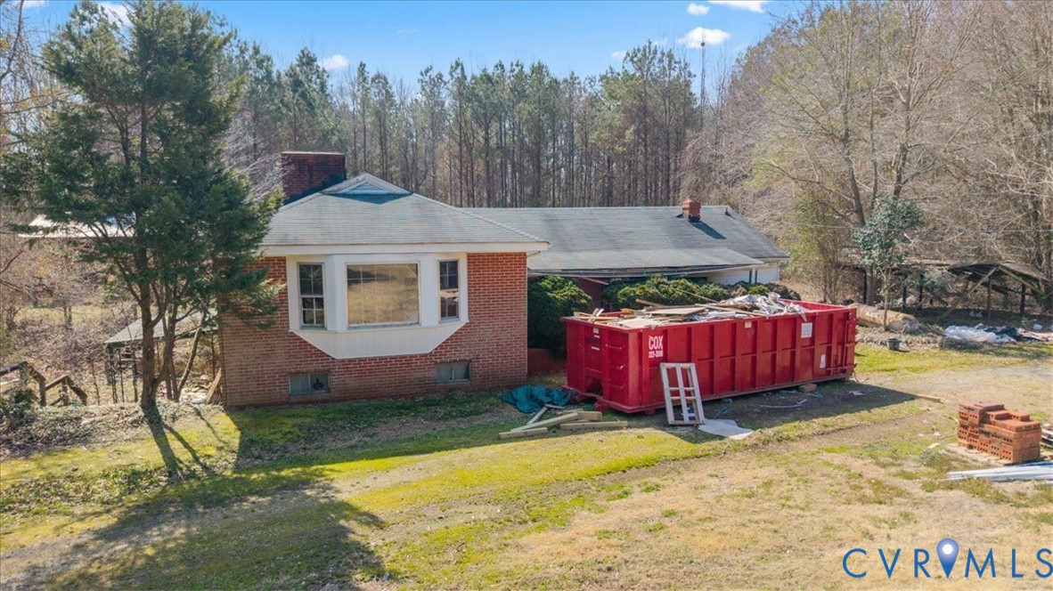 10401 Carriage Road Providence Forge, VA 23140 - Photo 18 of 30 a view of a house with swimming pool and yard with trees