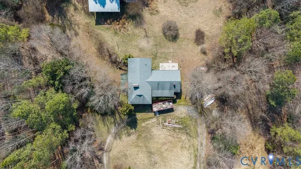 a aerial view of a house with a yard