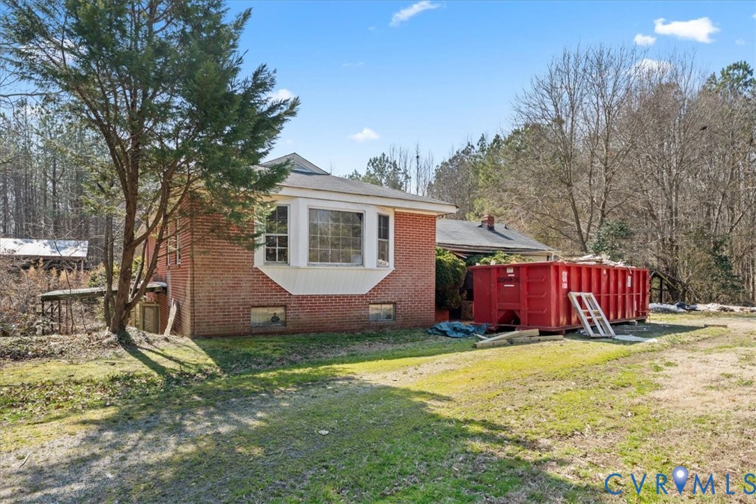10401 Carriage Road Providence Forge, VA 23140 - Photo 2 of 30 a view of house with backyard and trees