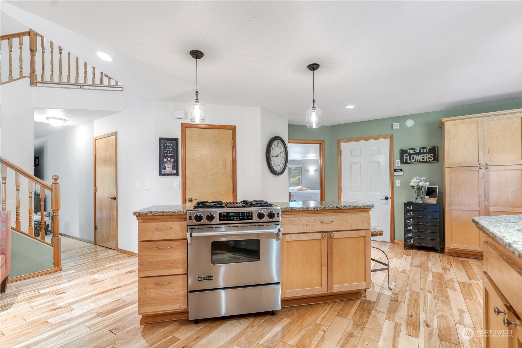2109 Grove Road Northwest Olympia, WA 98502 - Photo 14 of 40 a kitchen with a stove and a wooden floors