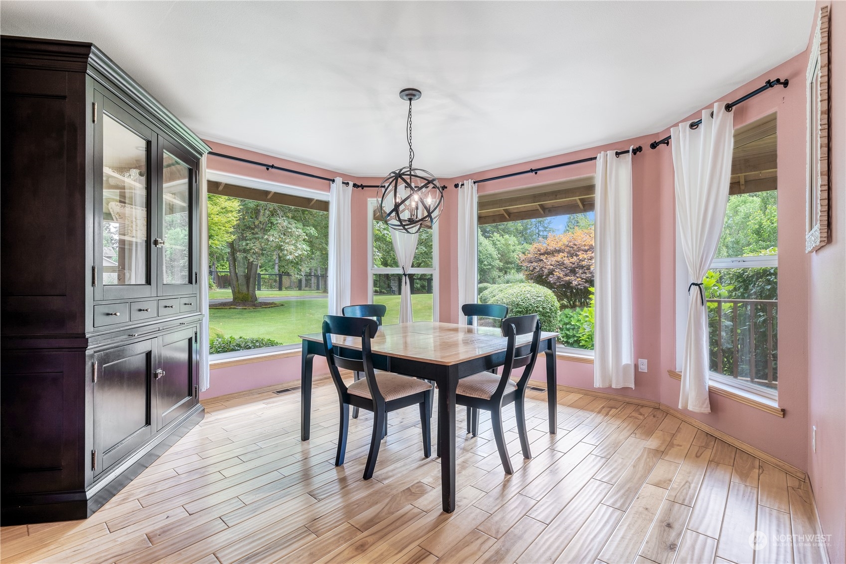 2109 Grove Road Northwest Olympia, WA 98502 - Photo 16 of 40 a dining room with furniture window and wooden floor