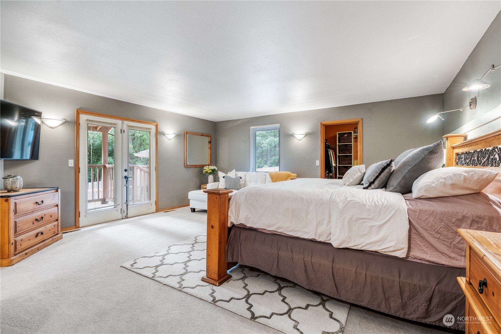 2109 Grove Road Northwest Olympia, WA 98502 - Photo 19 of 40 a spacious bedroom with a bed and glass door