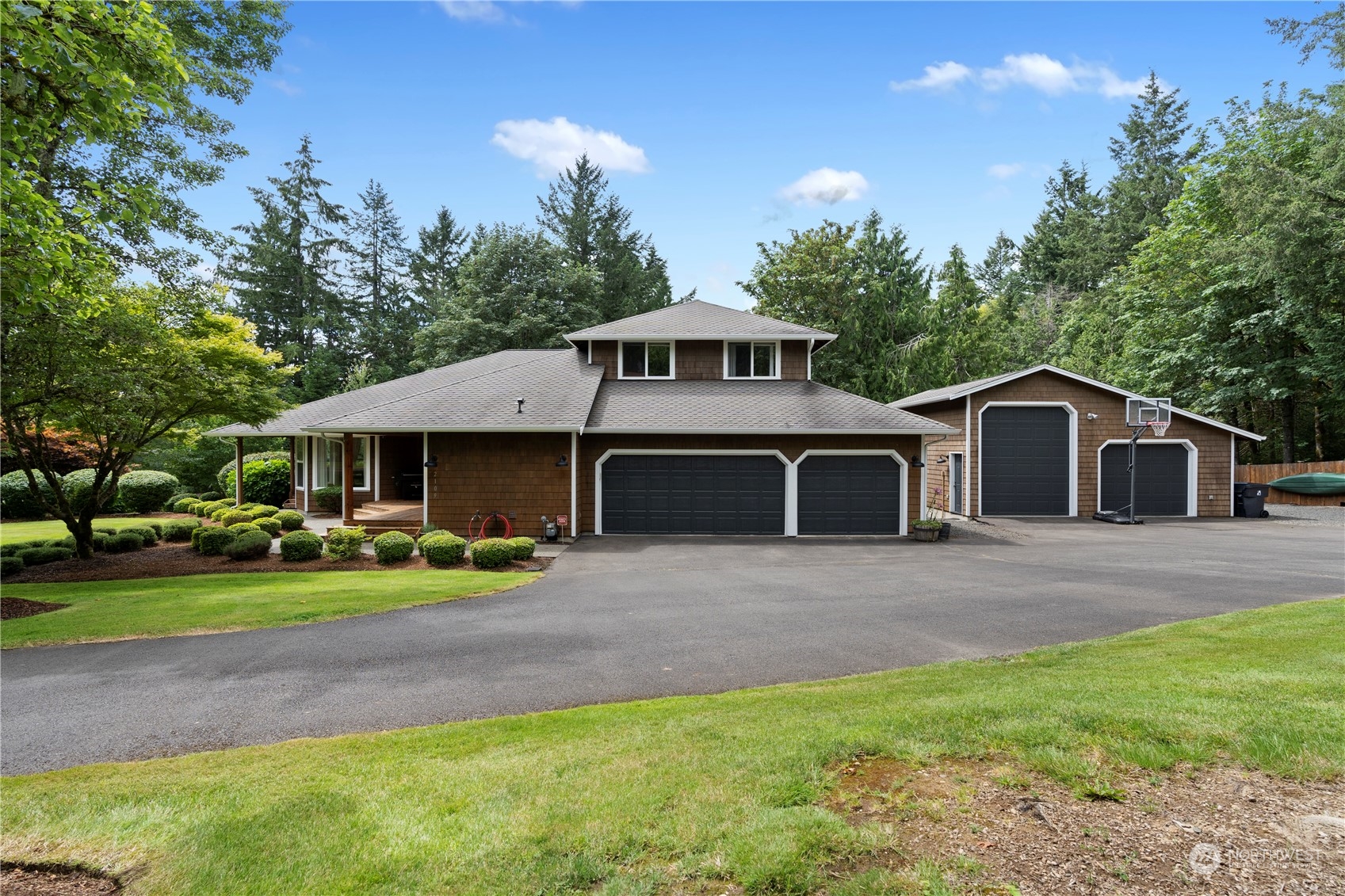 2109 Grove Road Northwest Olympia, WA 98502 - Photo 2 of 40 a front view of a house with a yard and trees