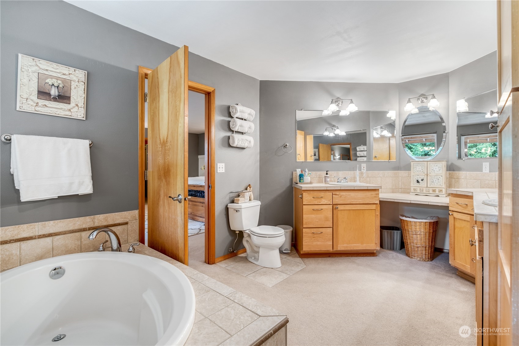 2109 Grove Road Northwest Olympia, WA 98502 - Photo 21 of 40 a spacious bathroom with a bathtub sink and toilet