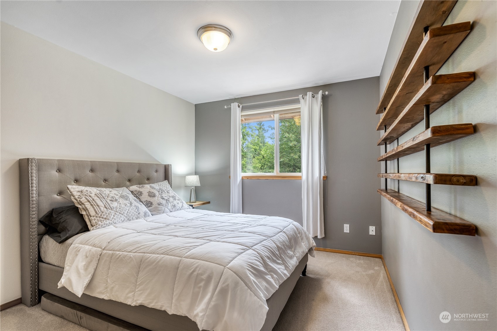 2109 Grove Road Northwest Olympia, WA 98502 - Photo 26 of 40 a bedroom with a bed and window