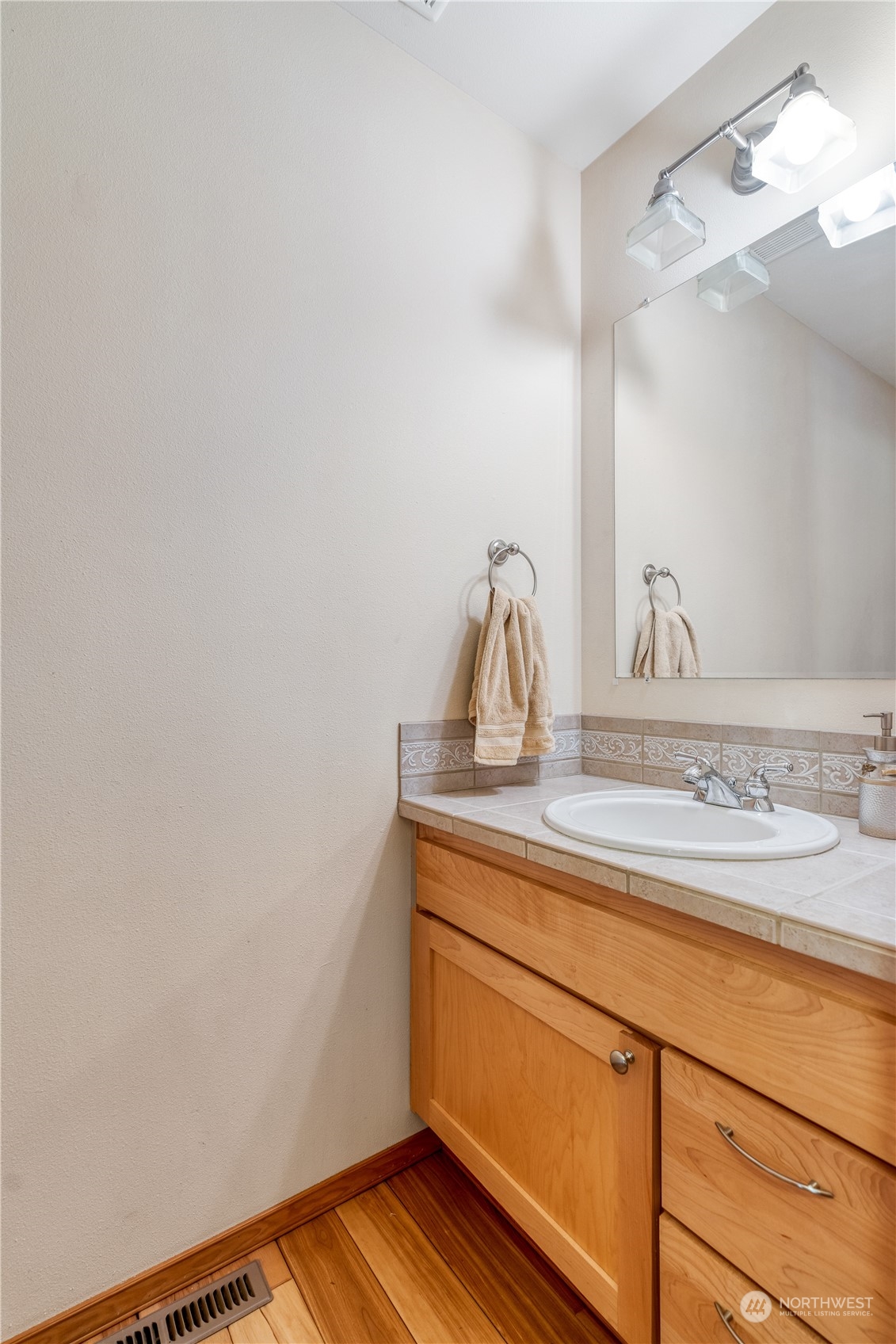 2109 Grove Road Northwest Olympia, WA 98502 - Photo 28 of 40 a bathroom with a sink and vanity